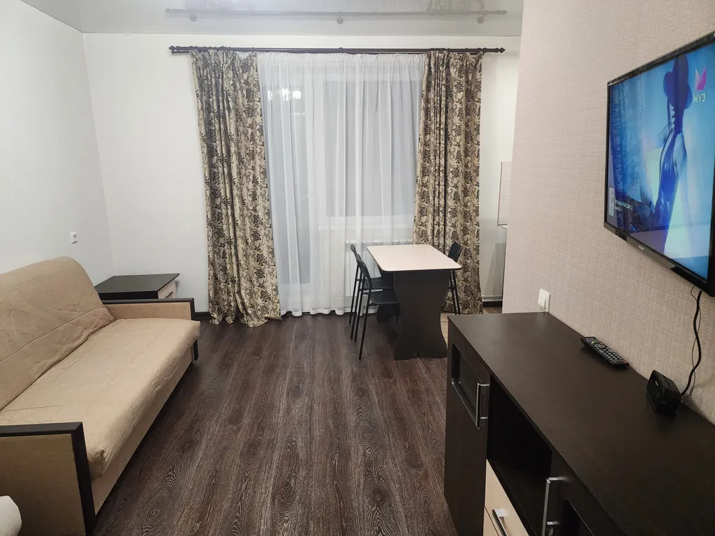 Уютная студия с видом на город рядом с вокзалом