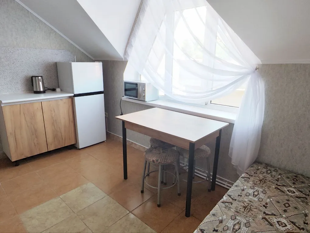 Апартаменты с 1 спальней на мансардном этаже гостевого дома Регион 86