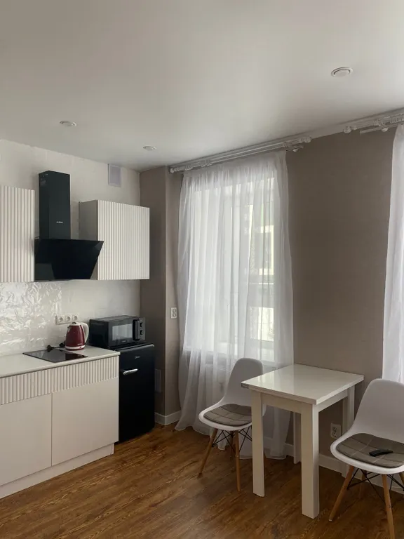 Уютная студия в зеленом массиве