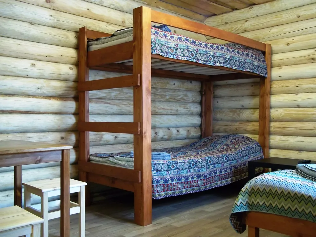 Уютная студия в доме из бревна