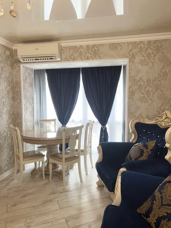 Апартамент с видом на море и на колесо обозрения