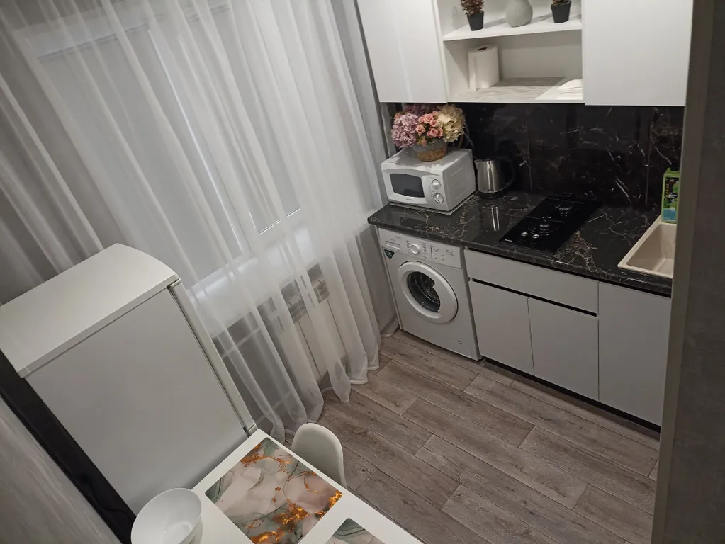 1-комнатная квартира в центре города с асфальтированной парковкой