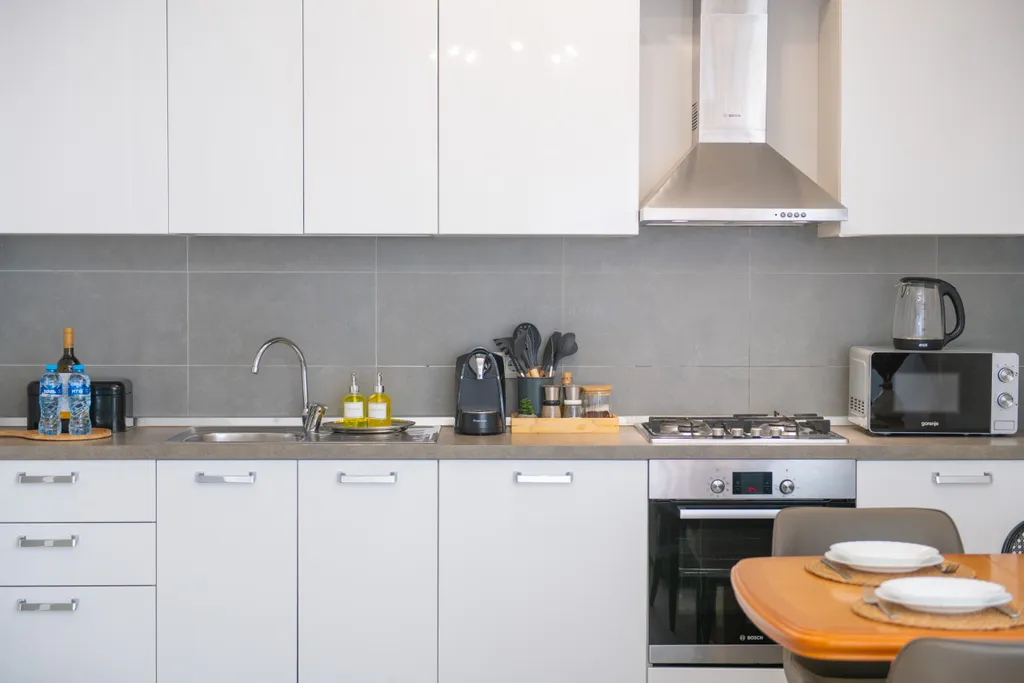 Уютные апартаменты с видом на колесо обозрения и город