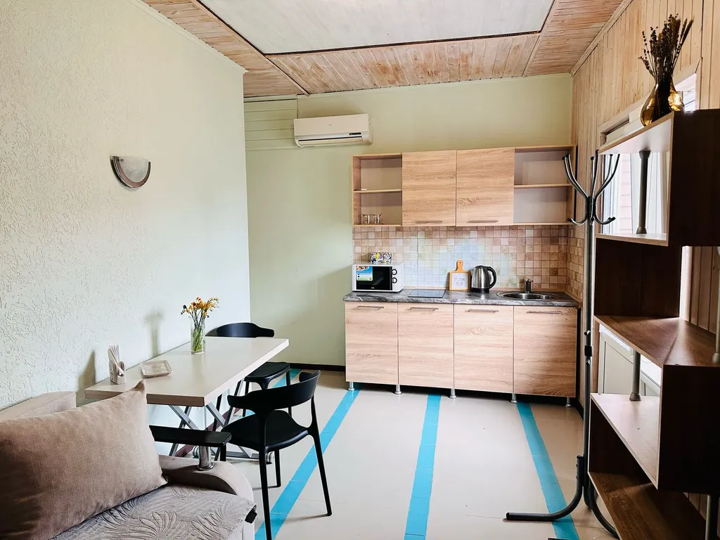 Семейный номер с кухней в центре