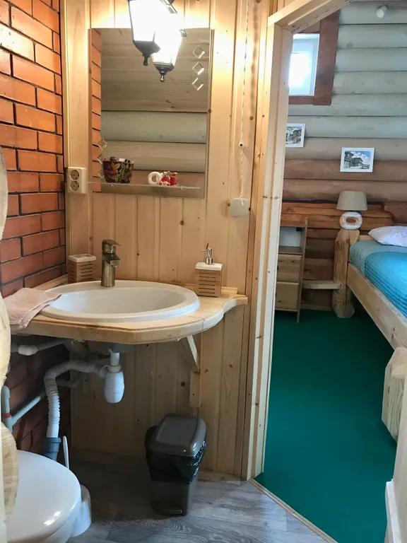 Дом из бревна Терем с сауной в черте города