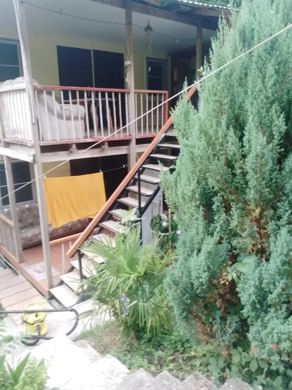 Комната у моря с видом на сад