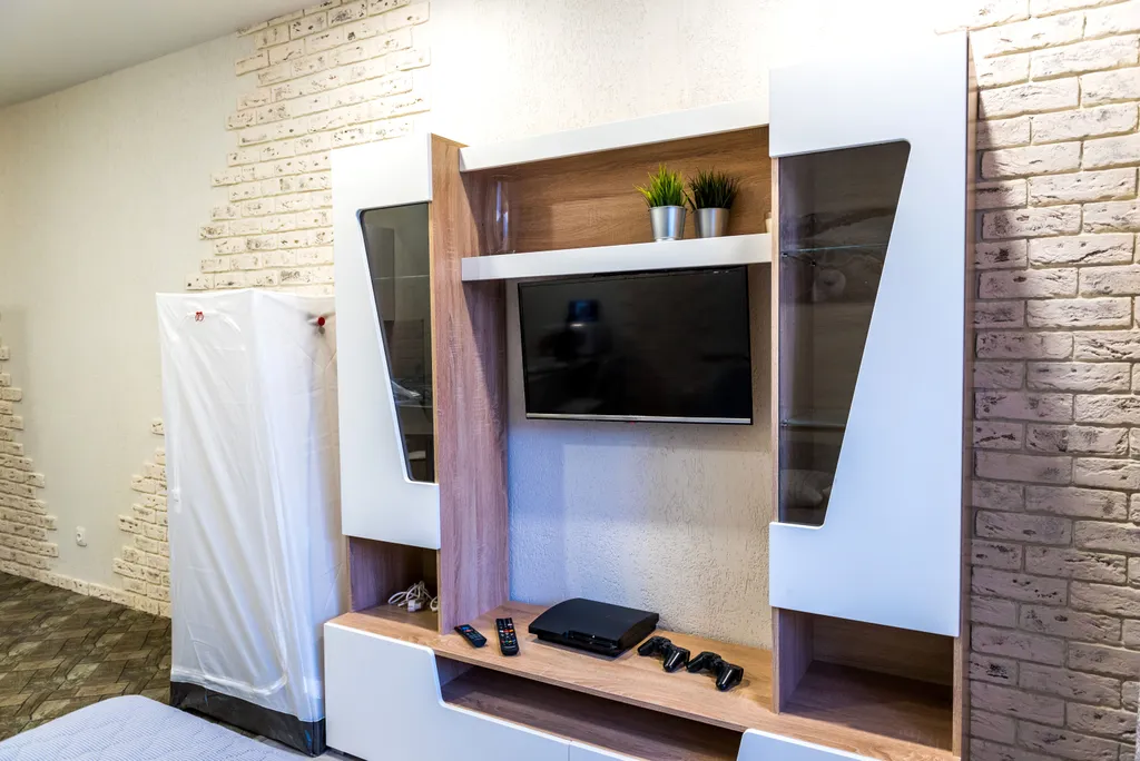 Уютная студия в центре города в стиле лофт с балконом