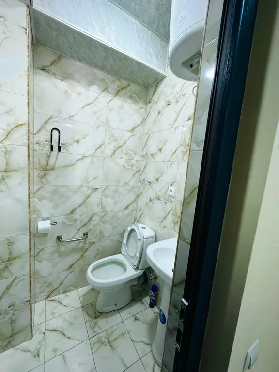 В центре рядом с музеем Сергея Параджанова