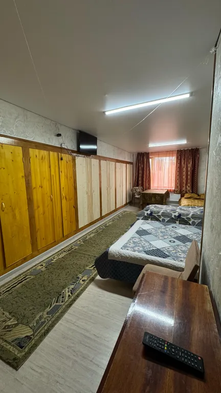 Дом-квартира с мансардой в центре