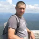 николай