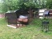 Во дворе дома на закрытой территории можно приготовить еду на мангале и отдохнуть в крытой беседке