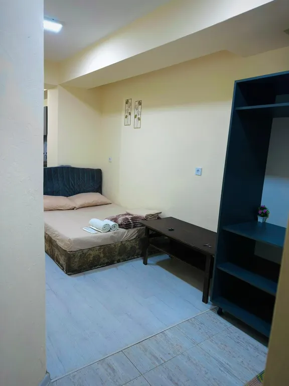 В центре рядом с музеем Сергея Параджанова