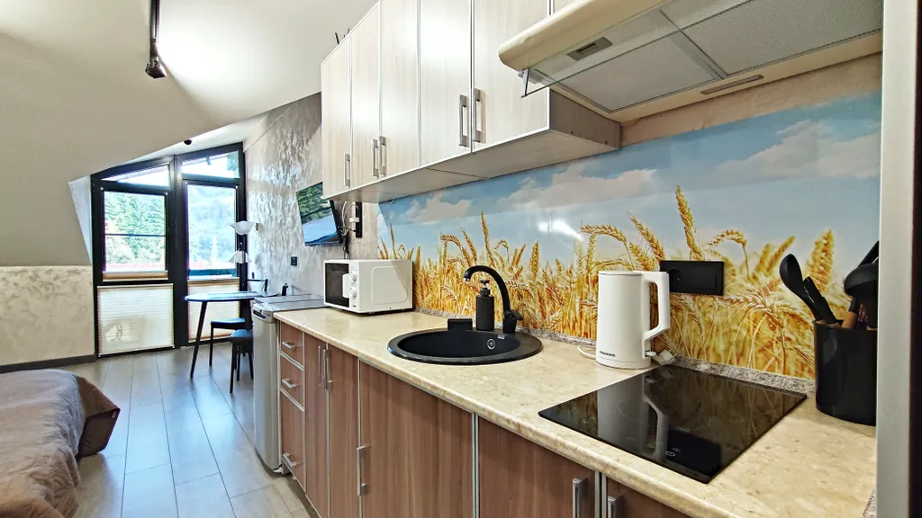 Уютная студия с балконом и красивым видом на горы