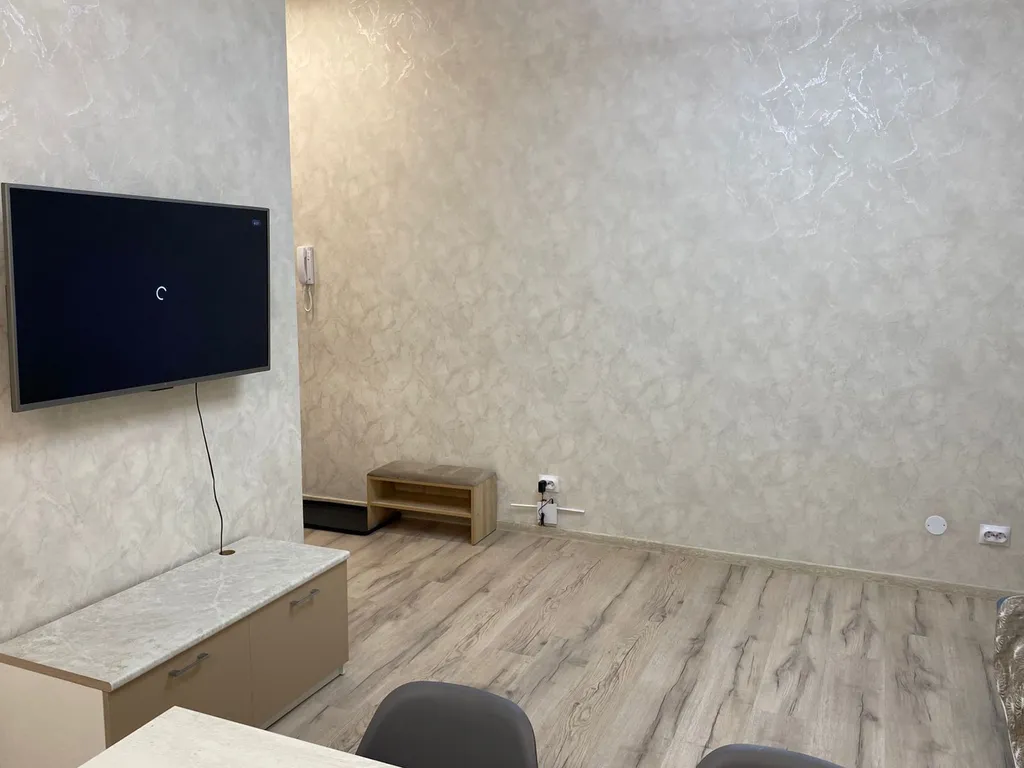 Уютная квартира в новом доме в 10 минутах от центра города