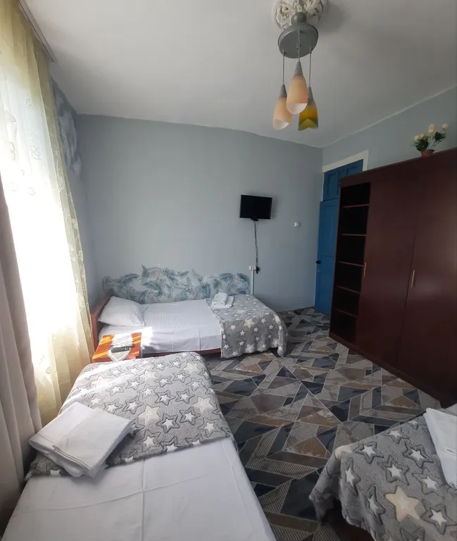 Трёхместный номер с тремя кроватями