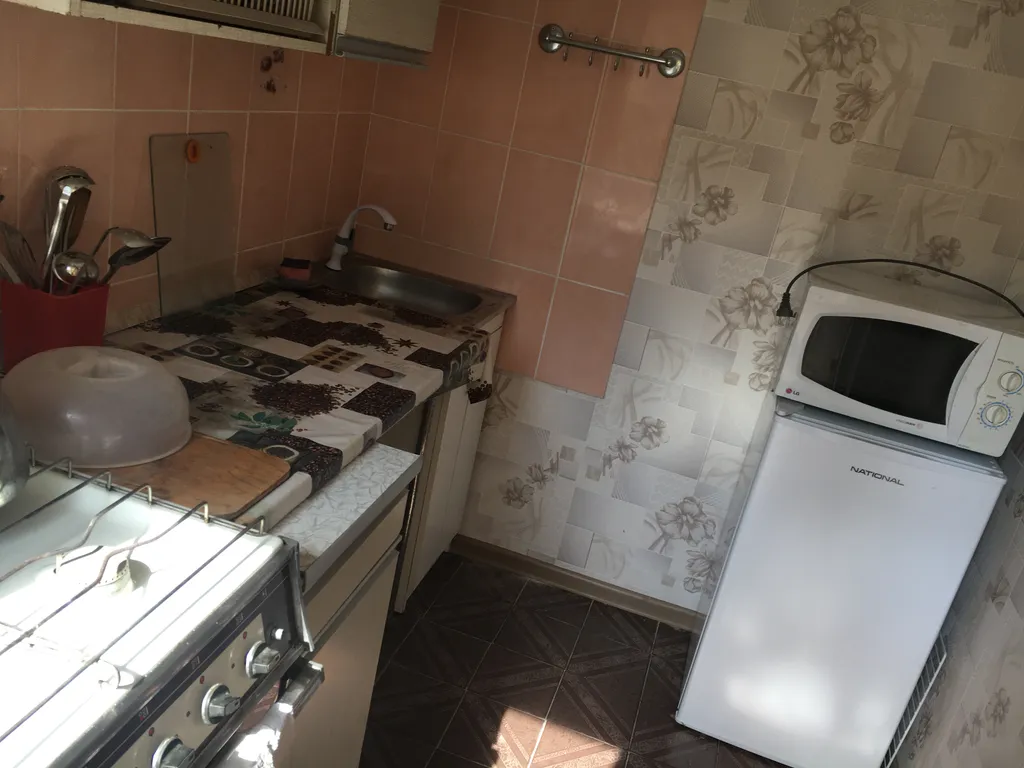 Номер с кухней в центре города со своим двориком