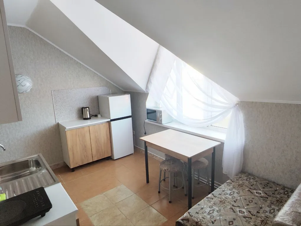 Апартаменты с 1 спальней на мансардном этаже гостевого дома Регион 86