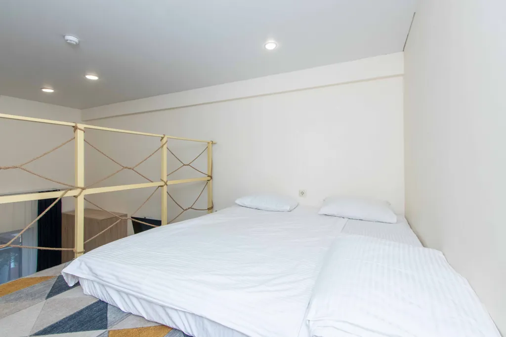 Четырёхместный стандарт с  широкими кроватями на двух уровнях