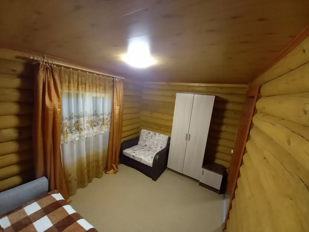 Домик из сосны в городе  С.