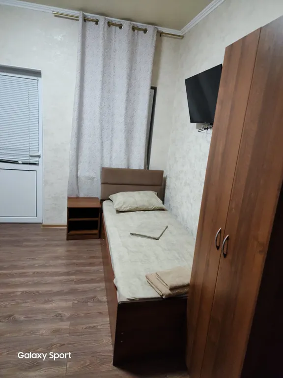 Трехместный номер с балконом и кухней