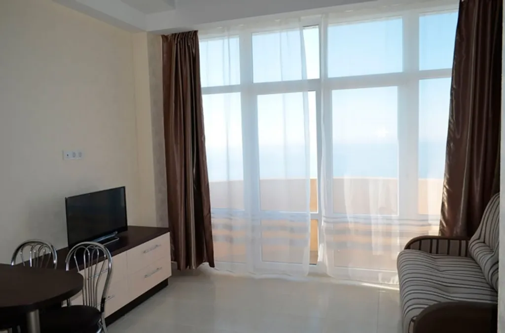 Студия на двоих с балконом у моря