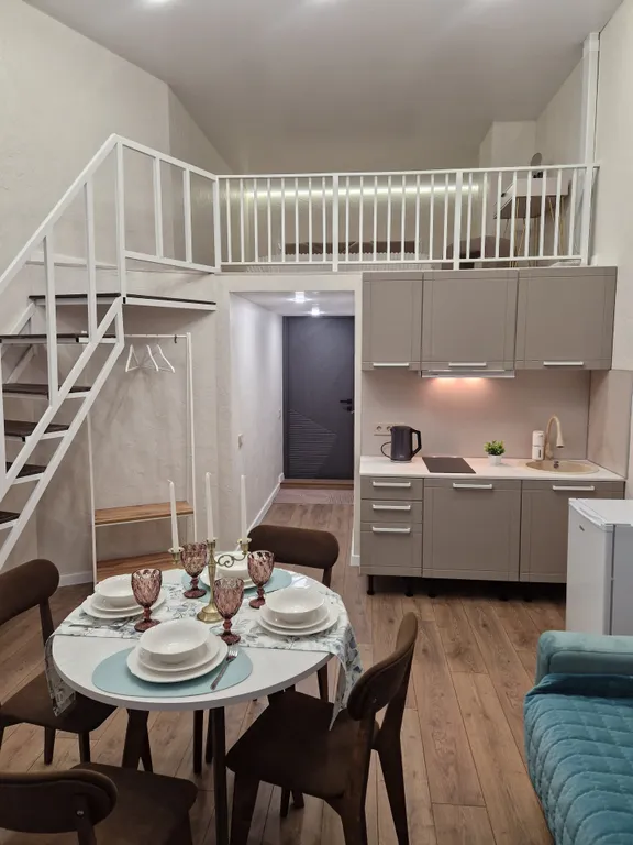 Уютная двухуровневая студия в центре