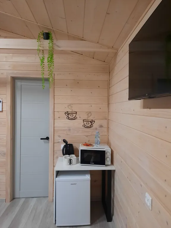 Уютный четырехместный Домик де-люкс с отдельными кроватями