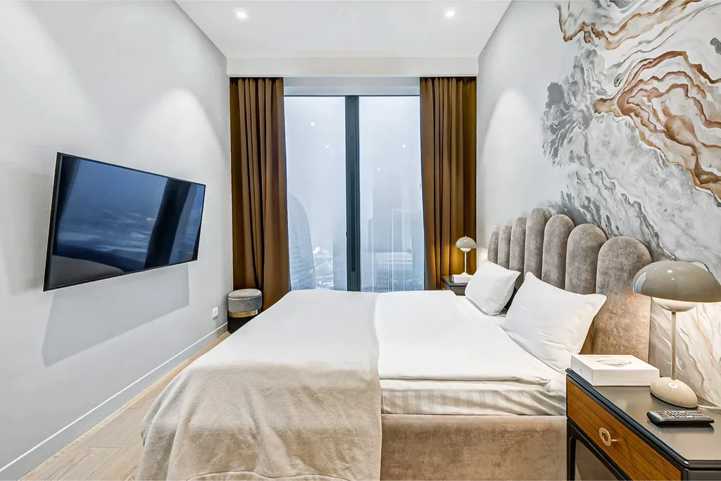 Комфортный и душевный апартамент с фантастическим видом на башни Сити