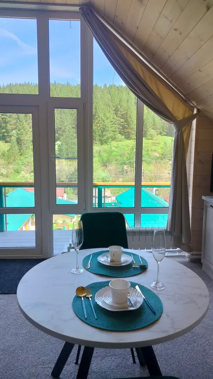 Апартаменты Романтика с панорамным окном в мансарде дома