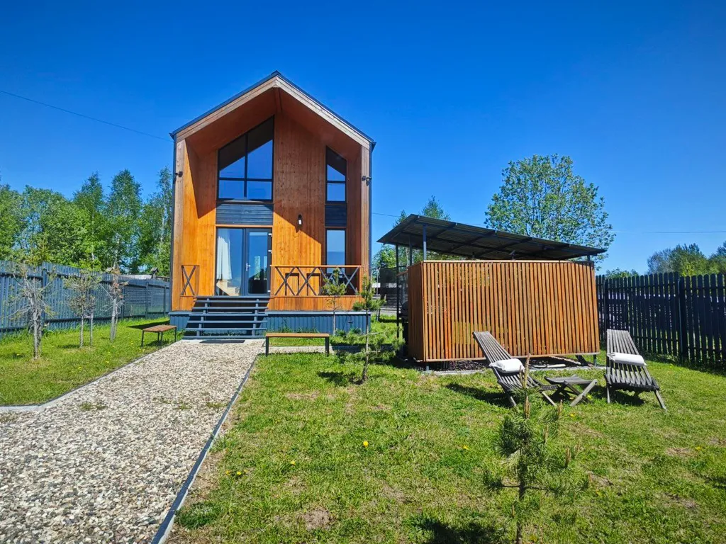 Коттедж с сауной для семейного отдыха в стиле барнхаус